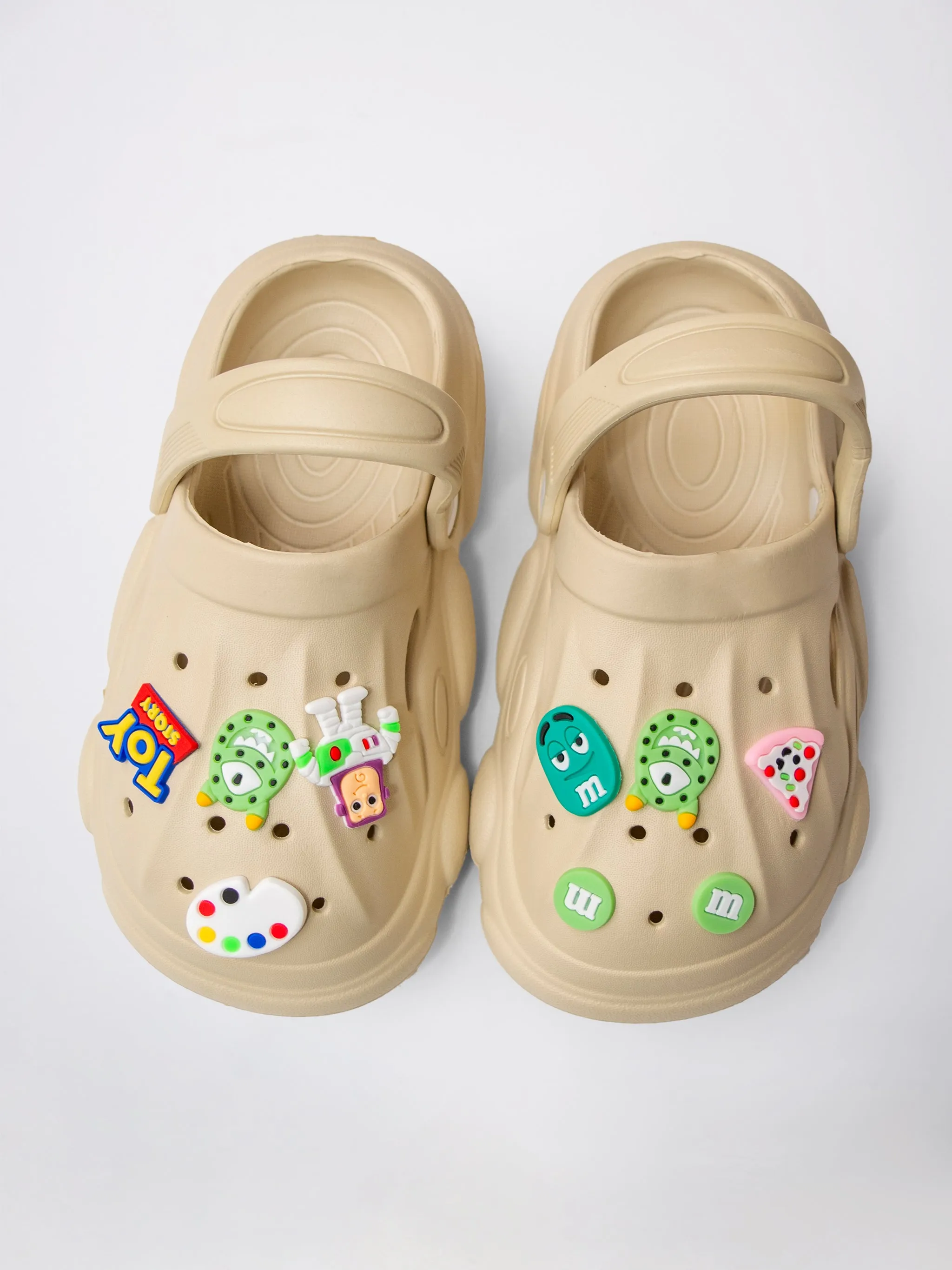 CLOGS WITH TOY-THEMED CHARMS